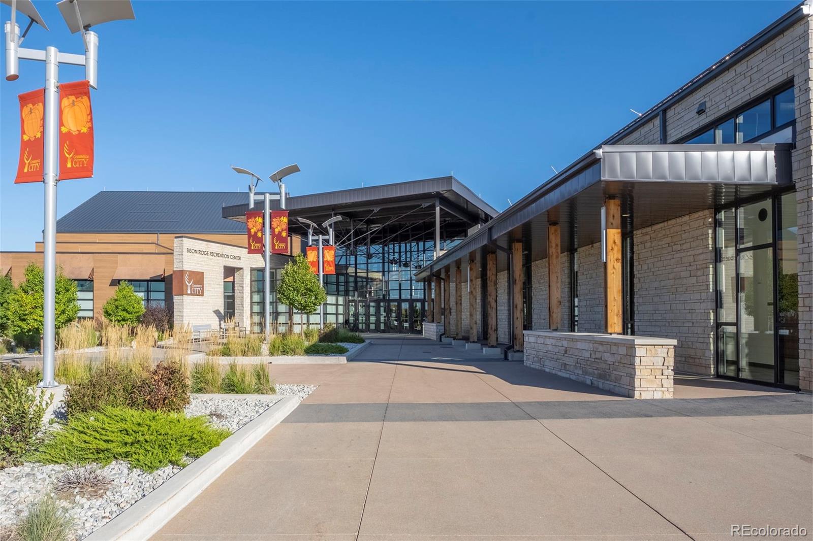 10985 Wheeling Street Commerce City, CO 80022 - Photo 44 of 45 a view of a house with a small yard and potted plants