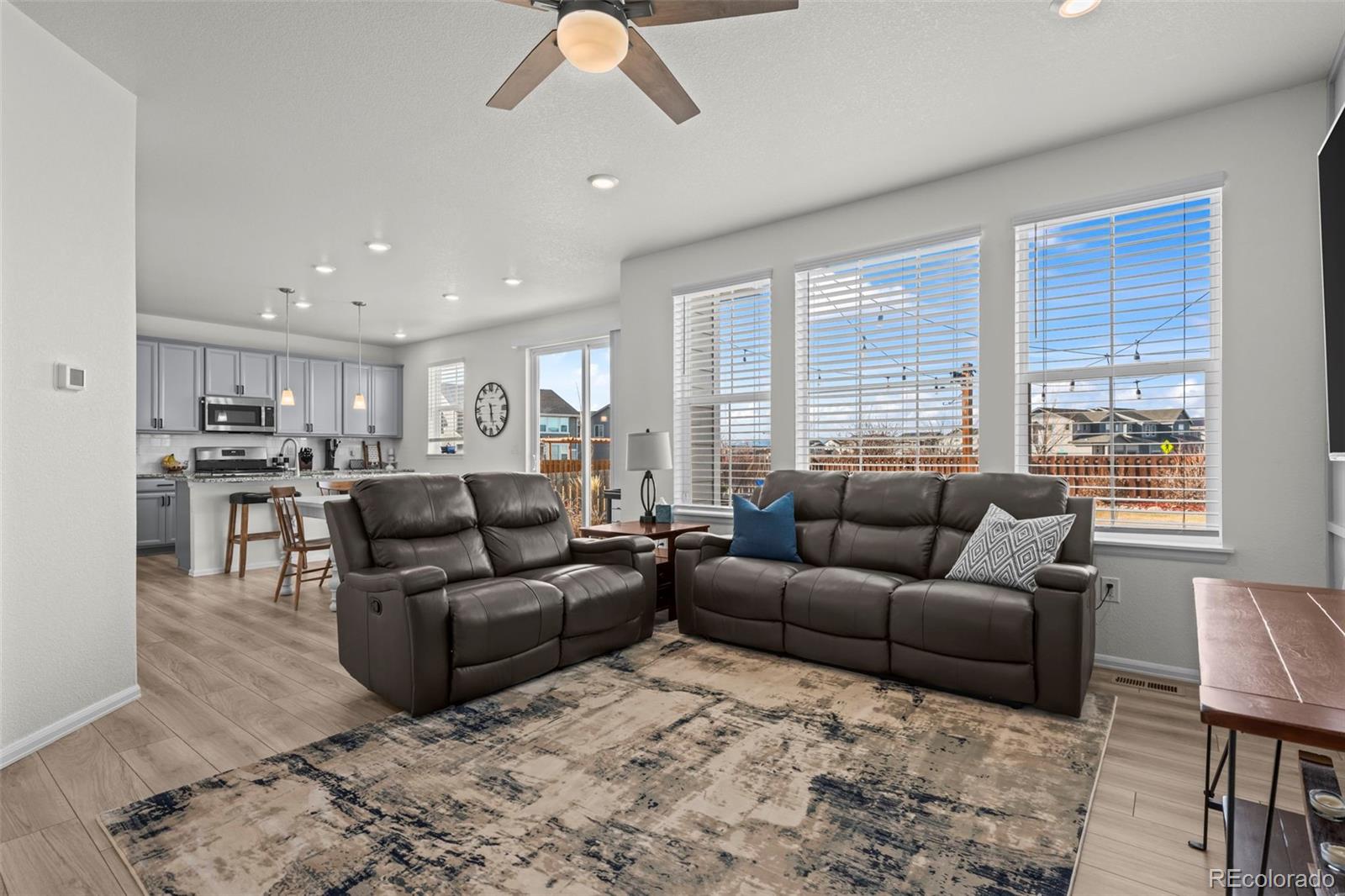 10985 Wheeling Street Commerce City, CO 80022 - Photo 6 of 45 a living room with furniture and a large window