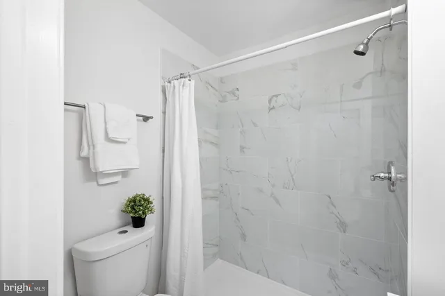 a bathroom with a shower curtain