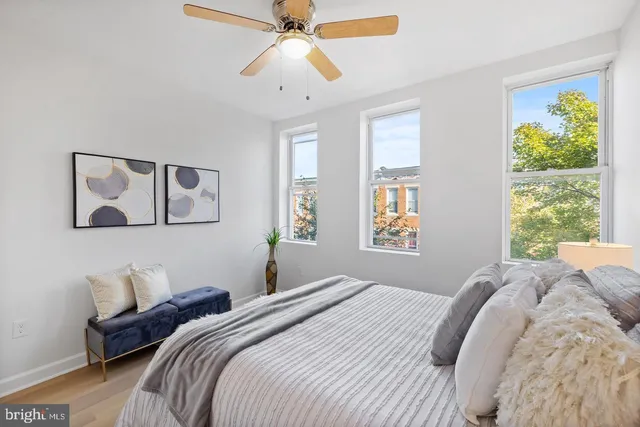 a bedroom with a large bed and a window