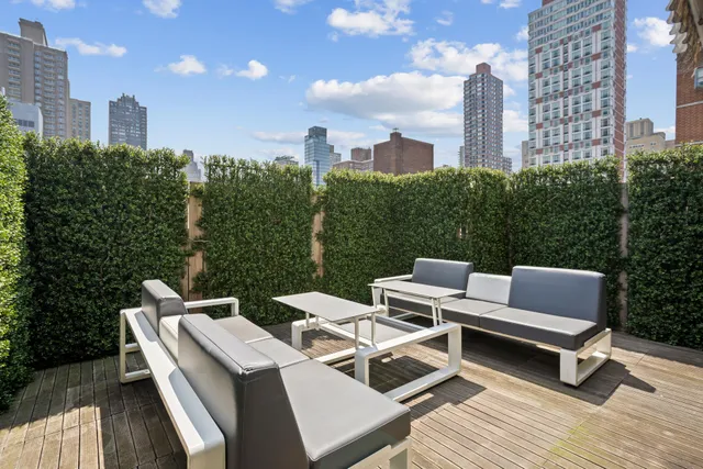 a balcony with view of outdoor space