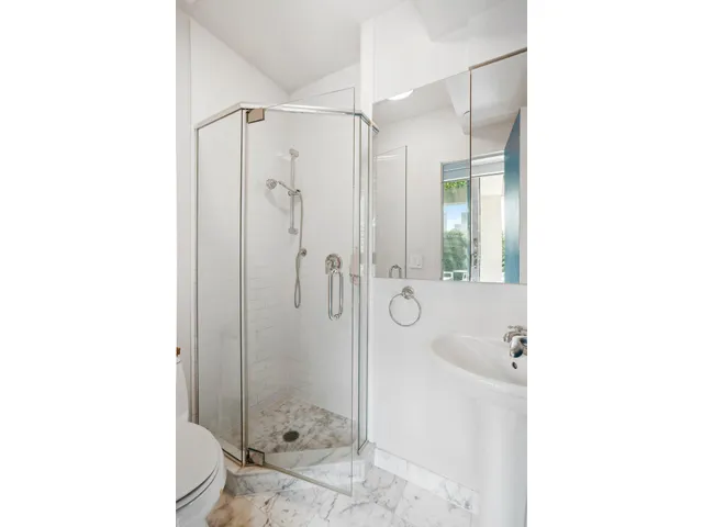 a couple of benches sitting next to a city view