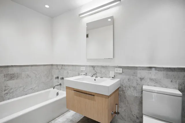 a bedroom with a large bed and a large window