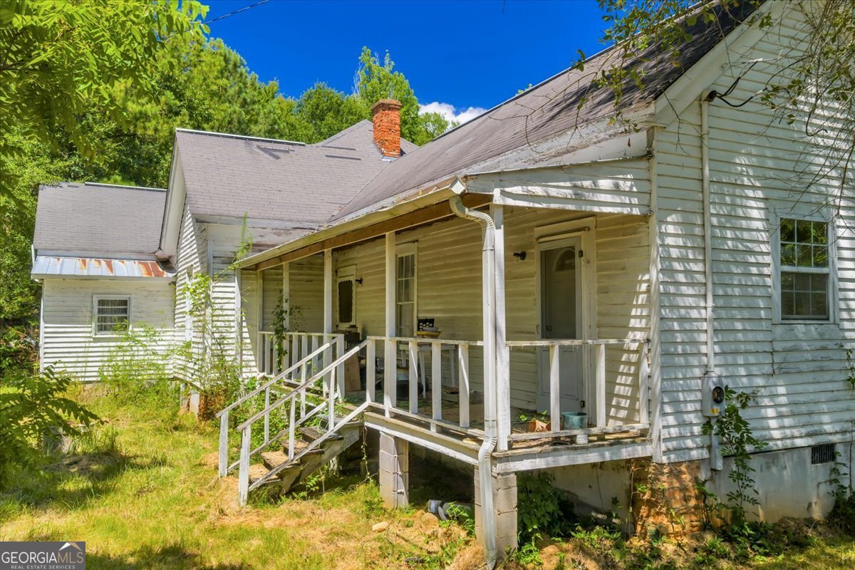 3442 Highway 83 Forsyth, GA 31029 - Photo 16 of 19 a view of a house with a small yard and potted plants