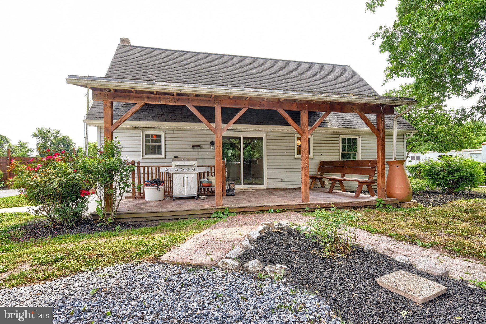3740 Beagle Road Middletown, PA 17057 - Photo 37 of 70 a front view of a house with a yard table and chairs