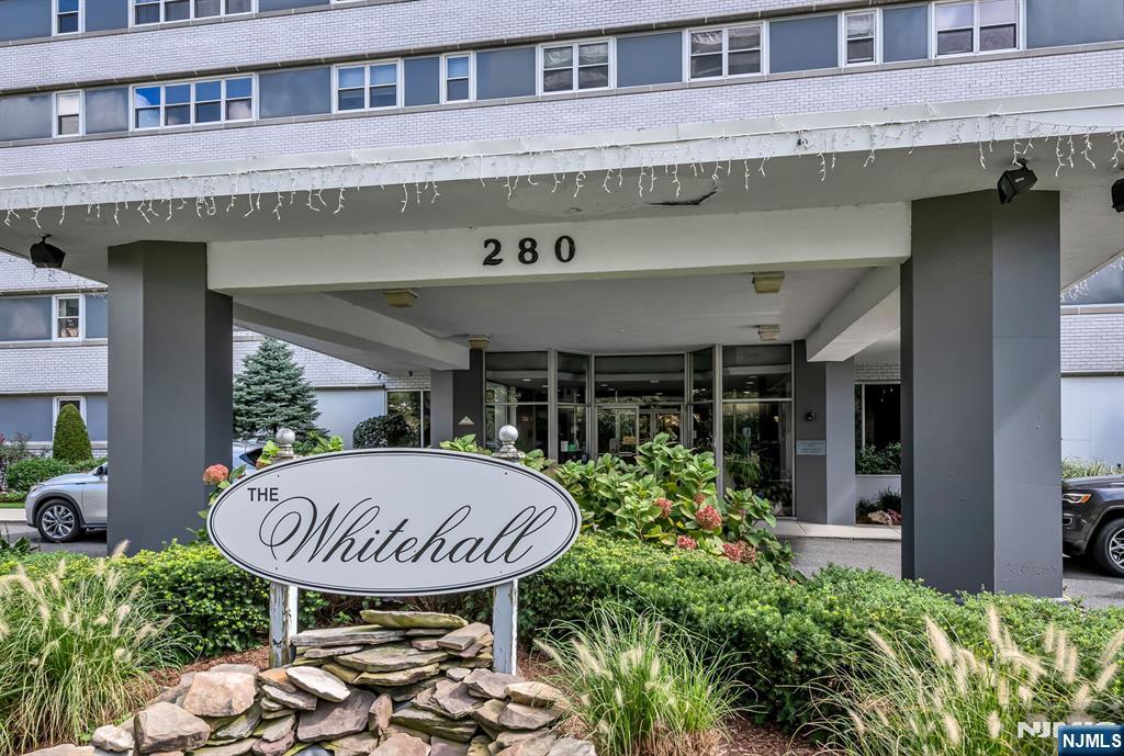 280 Prospect Avenue, Unit 1B Hackensack, NJ 07601 - Photo 2 of 36 a front view of a building with table and chairs