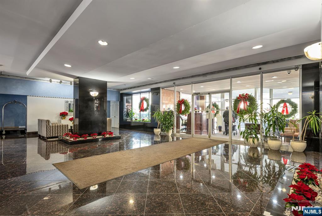 280 Prospect Avenue, Unit 1B Hackensack, NJ 07601 - Photo 26 of 36 a room with lots of potted plants and view of living room