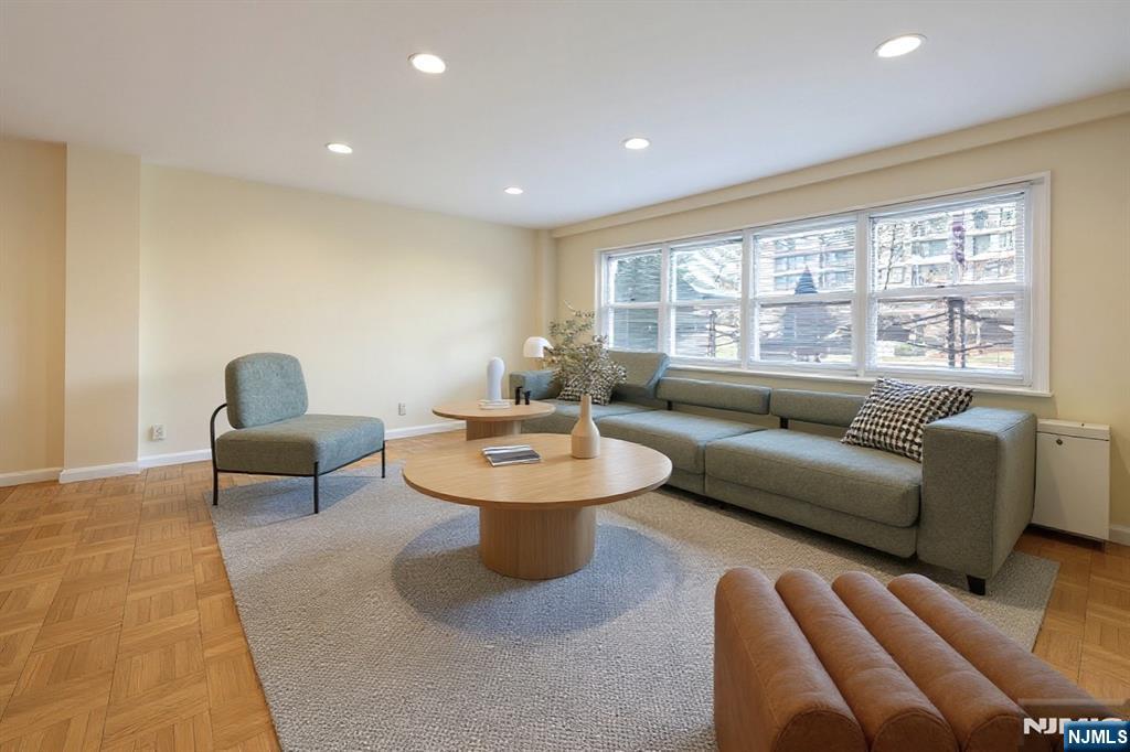 280 Prospect Avenue, Unit 1B Hackensack, NJ 07601 - Photo 7 of 36 a living room with furniture and a large window
