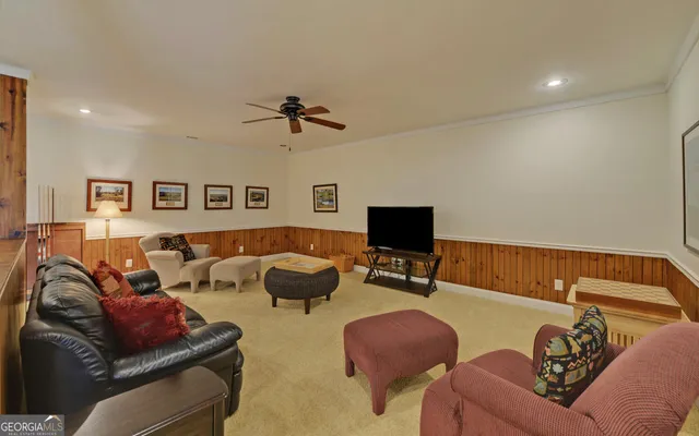 a room with pool table and window