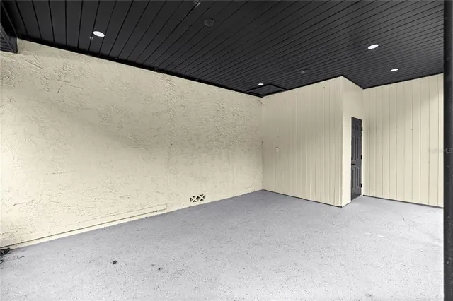 a bathroom with a bathtub and a window