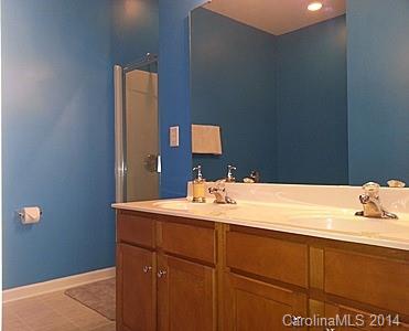 1109 Garrison Road Charlotte, NC 28262 - Photo 11 of 22 a bathroom with a sink vanity and mirror