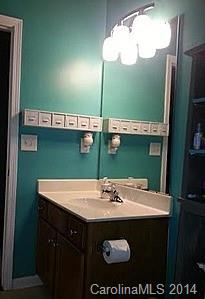 1109 Garrison Road Charlotte, NC 28262 - Photo 12 of 22 a bathroom with a sink and a mirror