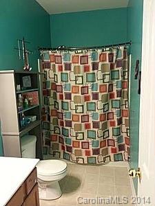 1109 Garrison Road Charlotte, NC 28262 - Photo 13 of 22 a bathroom with a toilet and a shower