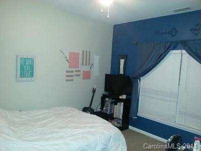 1109 Garrison Road Charlotte, NC 28262 - Photo 14 of 22 a bedroom with a bed and a window