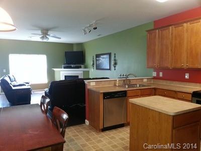 1109 Garrison Road Charlotte, NC 28262 - Photo 4 of 22 a kitchen with a stove and a microwave