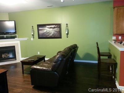 1109 Garrison Road Charlotte, NC 28262 - Photo 5 of 22 a living room with furniture and a fireplace