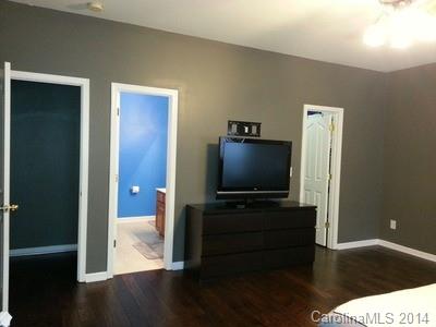 1109 Garrison Road Charlotte, NC 28262 - Photo 7 of 22 a living room with flat screen tv and wooden floor