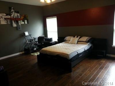 1109 Garrison Road Charlotte, NC 28262 - Photo 8 of 22 a bedroom with two beds and a window