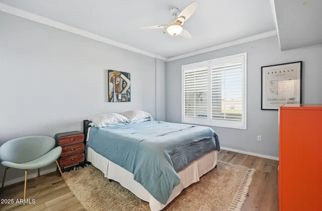 a bedroom with a bed dresser and a window