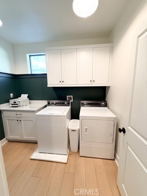 27628 Exploration Newhall, CA 91381 - Photo 14 of 15 a utility room with cabinets washer and dryer