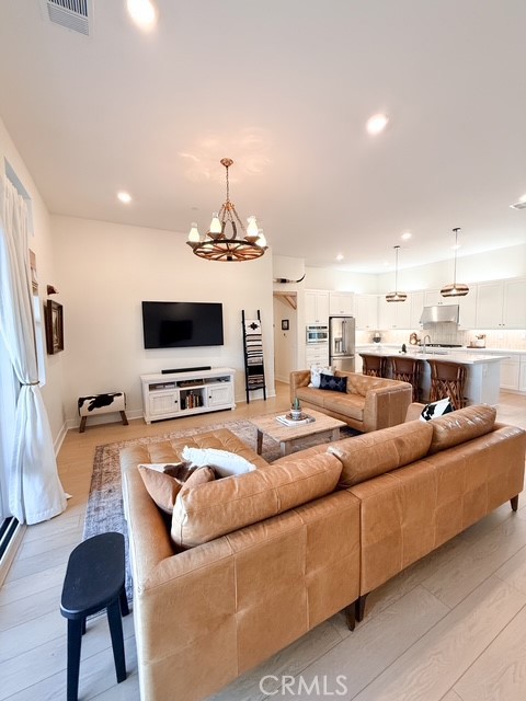 27628 Exploration Newhall, CA 91381 - Photo 2 of 15 a living room with furniture and a flat screen tv