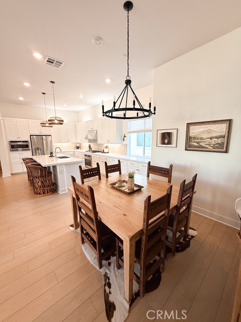 27628 Exploration Newhall, CA 91381 - Photo 4 of 15 a view of a dining room with furniture