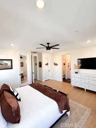 a bedroom with a bed and a couch