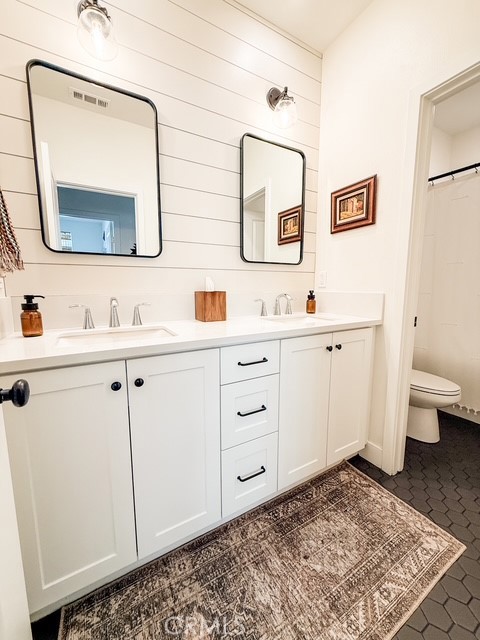 27628 Exploration Newhall, CA 91381 - Photo 9 of 15 a bathroom with a toilet sink and mirror