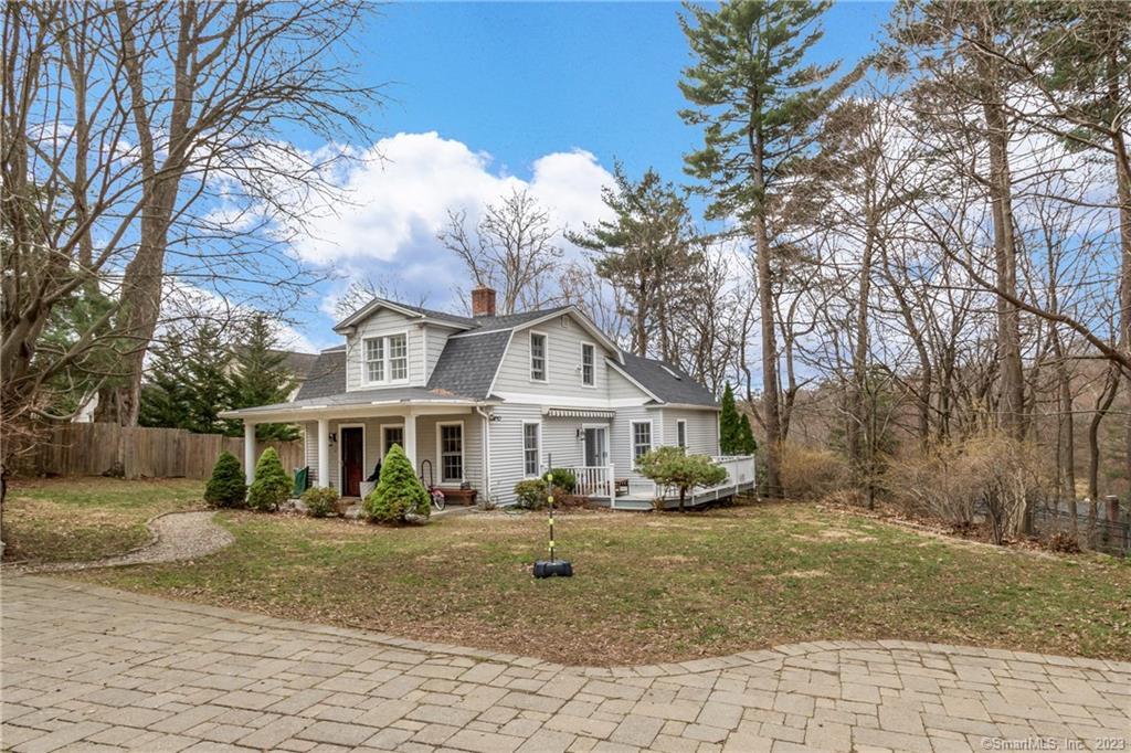 4 Prospect Road Westport, CT 06880 - Photo 1 of 1 a front view of a house with a yard