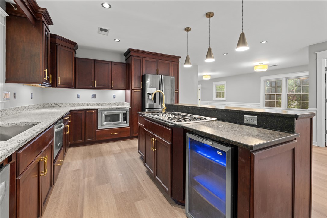 309 Woodland Way Clemson, SC 29631 - Photo 9 of 43 This kitchen features a sleek design with ample counter space and modern amenities, ideal for culinary pursuits.