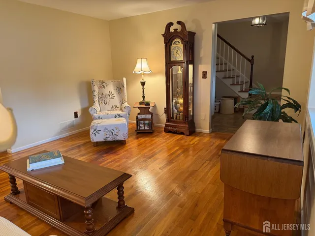 a room with wooden floor and furniture