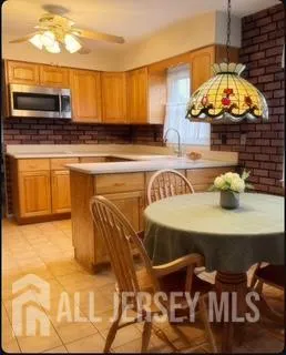 a kitchen with a table and chairs in it