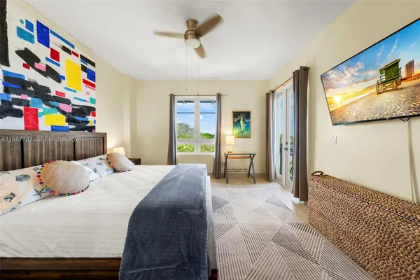 a bedroom with a bed and a cabinets