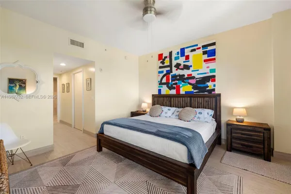 a bedroom with a bed and a dresser