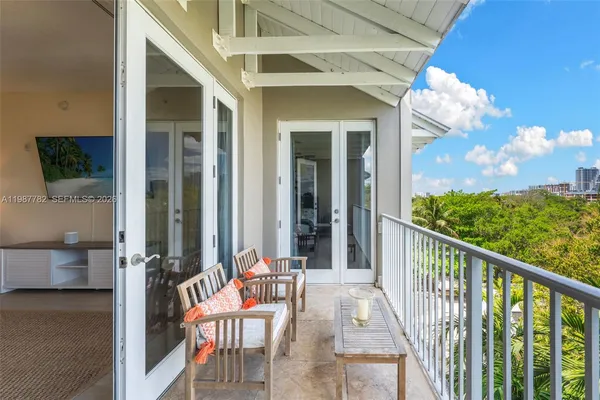 a view of a balcony with furniture