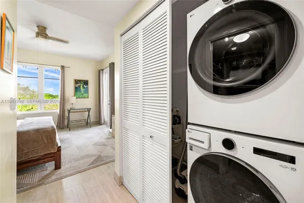 a view of a hallway with washer and dryer