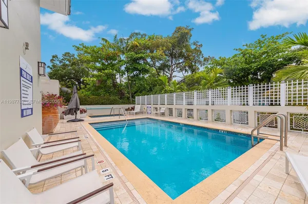 a view of a swimming pool with a patio