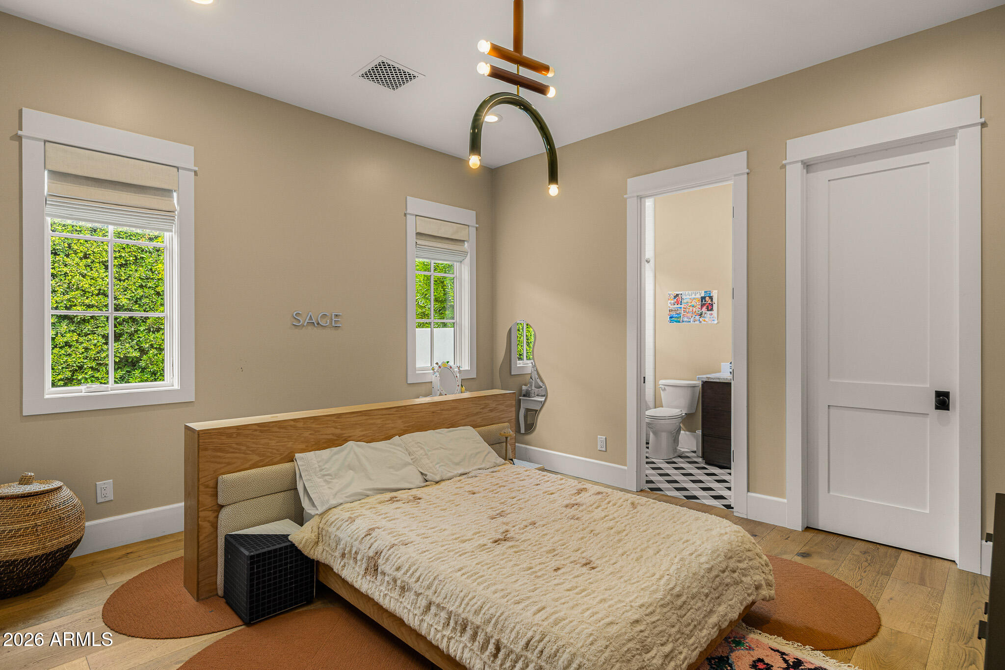 4204 North 57th Way Phoenix, AZ 85018 - Photo 28 of 34 a bedroom with a bed and window