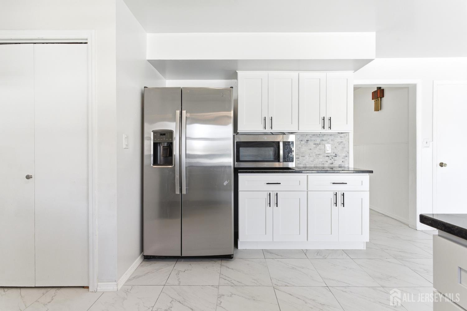 7 Oberlin Court Edison, NJ 08820 - Photo 16 of 45 a kitchen with stainless steel appliances granite countertop a refrigerator and a sink