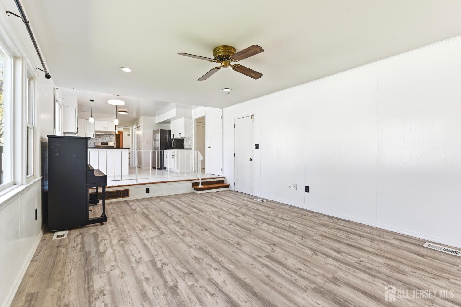 7 Oberlin Court Edison, NJ 08820 - Photo 19 of 45 a view of empty room with wooden floor and window