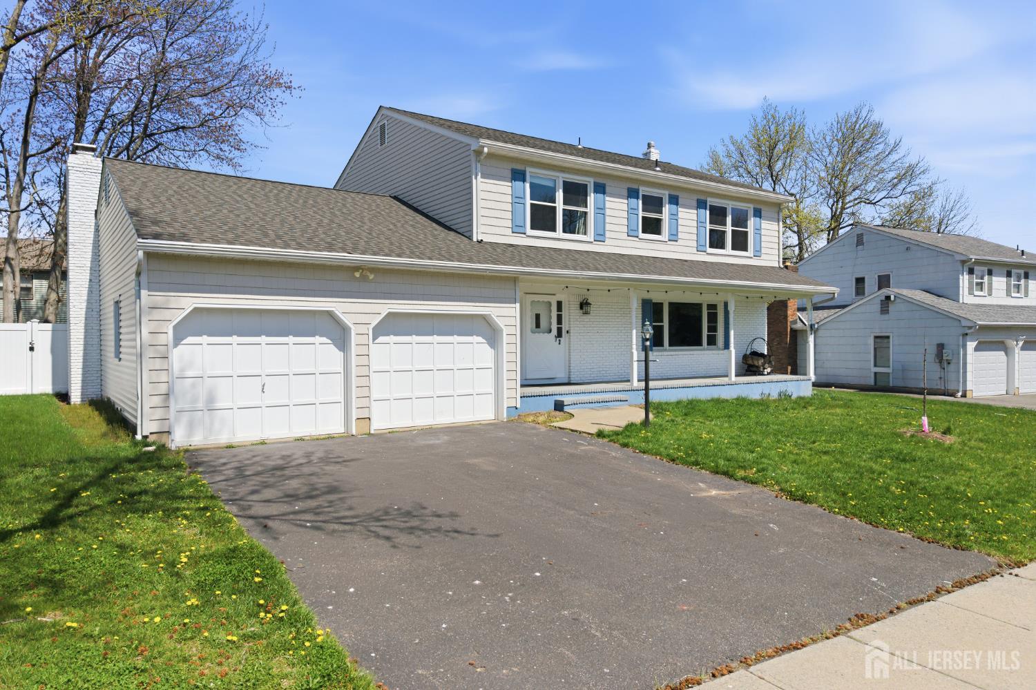 7 Oberlin Court Edison, NJ 08820 - Photo 2 of 45 a front view of a house with a yard and garage