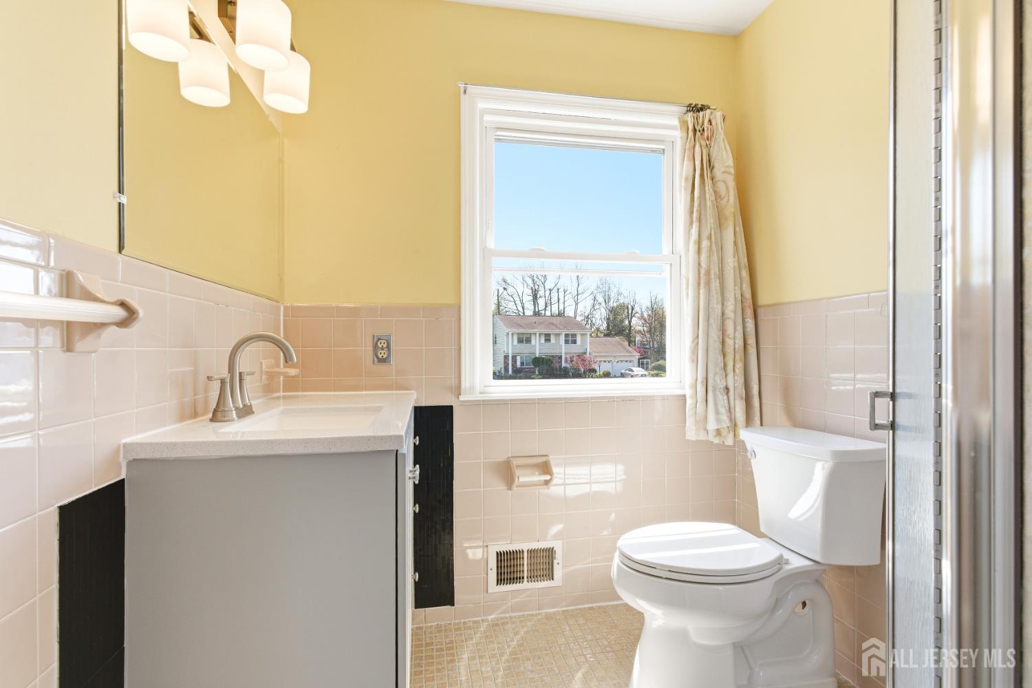 7 Oberlin Court Edison, NJ 08820 - Photo 26 of 45 a bathroom with a toilet a sink and a window