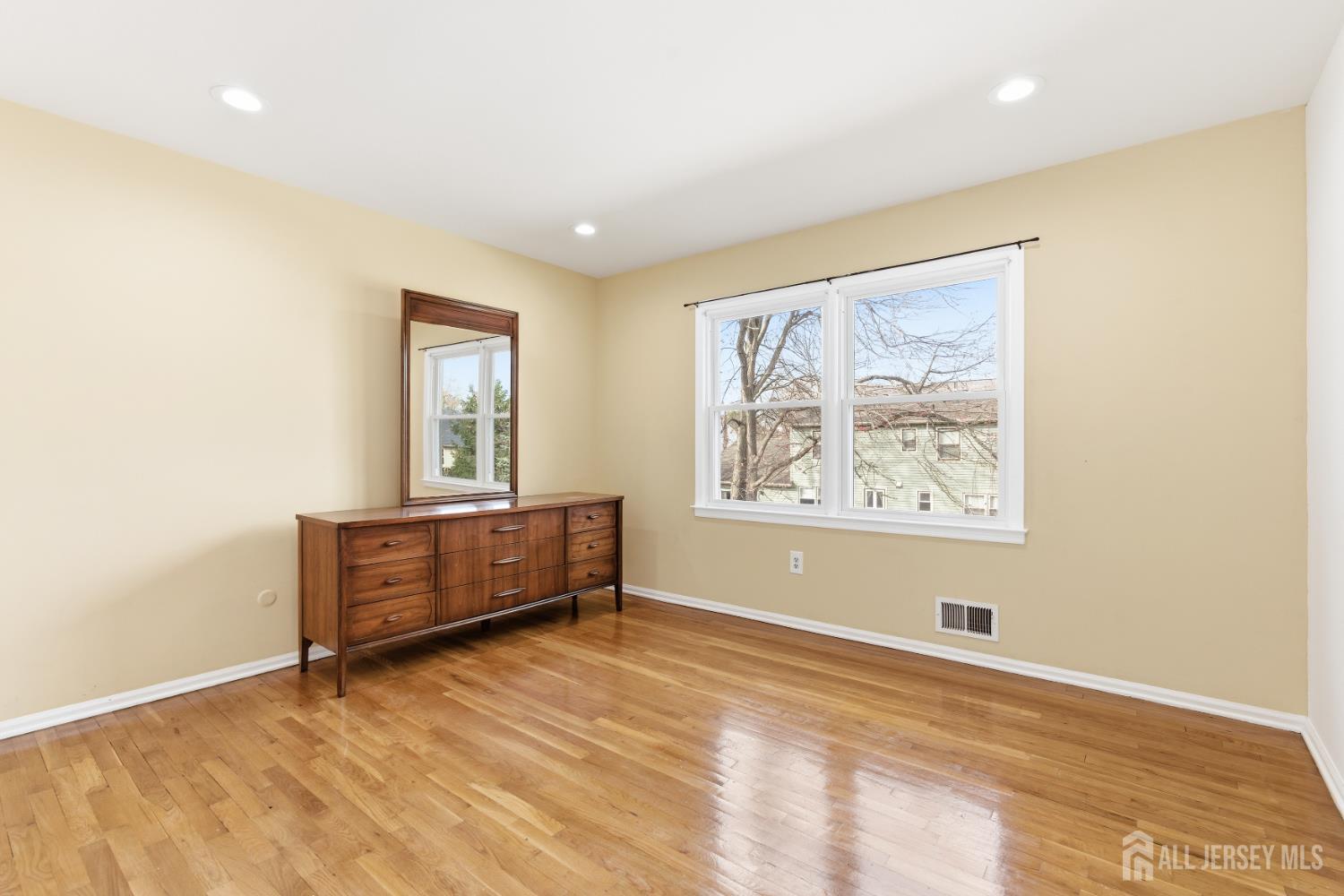 7 Oberlin Court Edison, NJ 08820 - Photo 28 of 45 a view of room with window and wooden floor