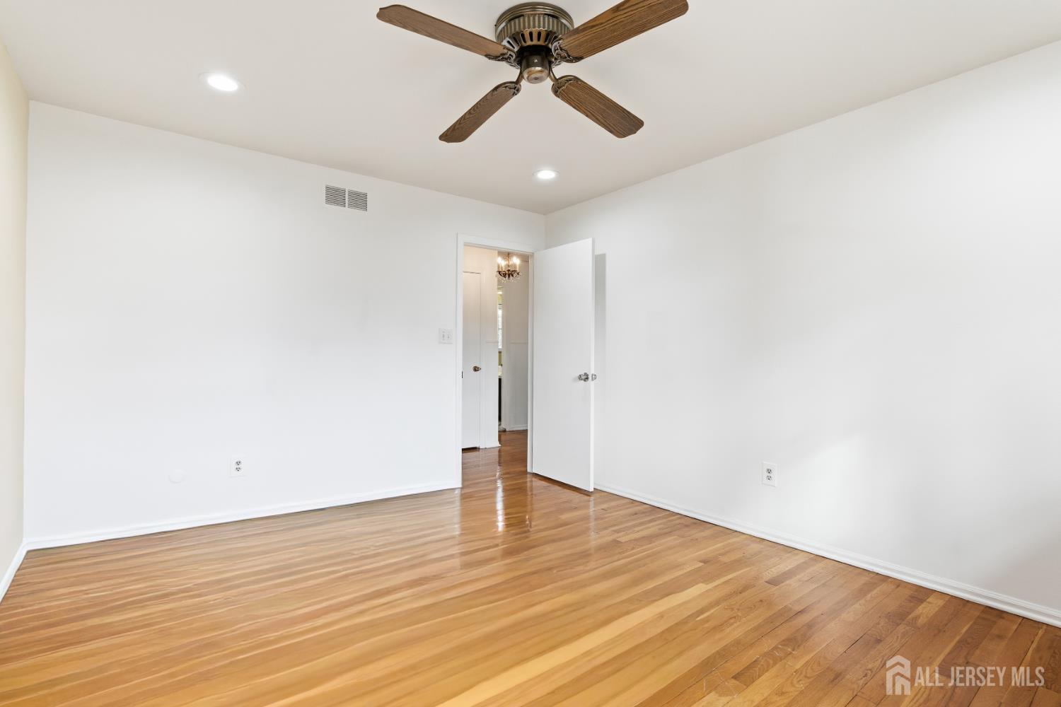 7 Oberlin Court Edison, NJ 08820 - Photo 30 of 45 a view of empty room with wooden floor