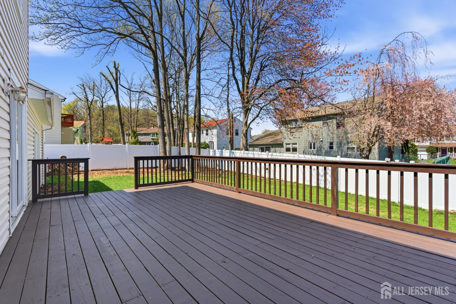 7 Oberlin Court Edison, NJ 08820 - Photo 38 of 45 a view of a deck with a yard and wooden fence