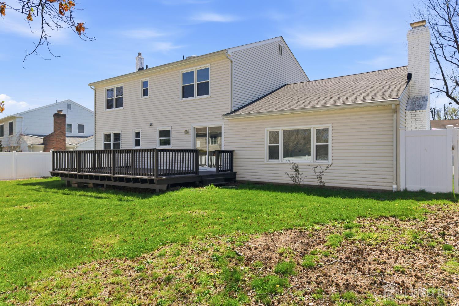 7 Oberlin Court Edison, NJ 08820 - Photo 41 of 45 a view of backyard with garden and deck