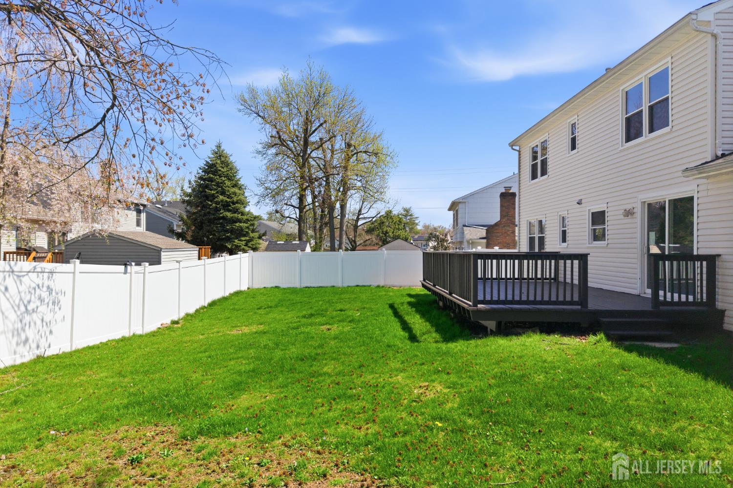 7 Oberlin Court Edison, NJ 08820 - Photo 42 of 45 a view of a garden with a small yard and wooden fence