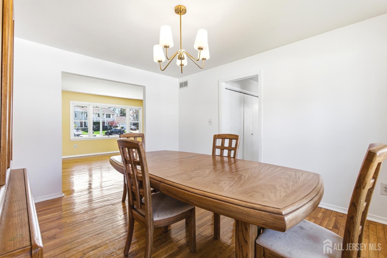 7 Oberlin Court Edison, NJ 08820 - Photo 10 of 45 a view of a dining room with furniture window and wooden floor