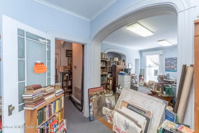 a view of a hallway with wooden floor and entryway