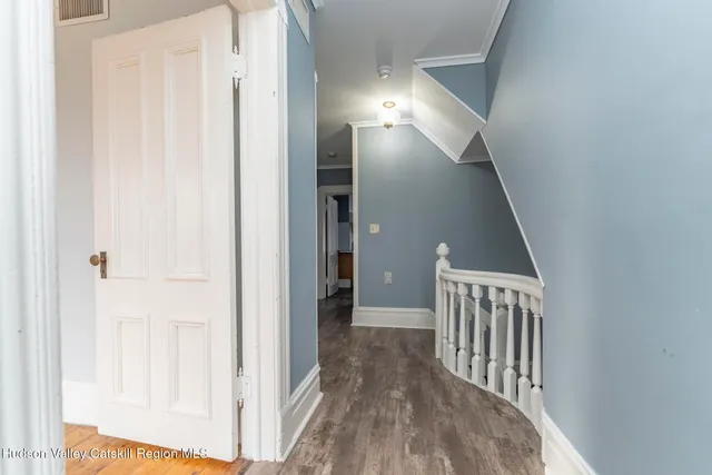 a view of a hallway with closet area